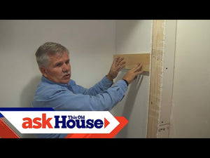 Ask This Old House general contractor Tom Silva trims a coat closet by installing a clothes rod and shelf